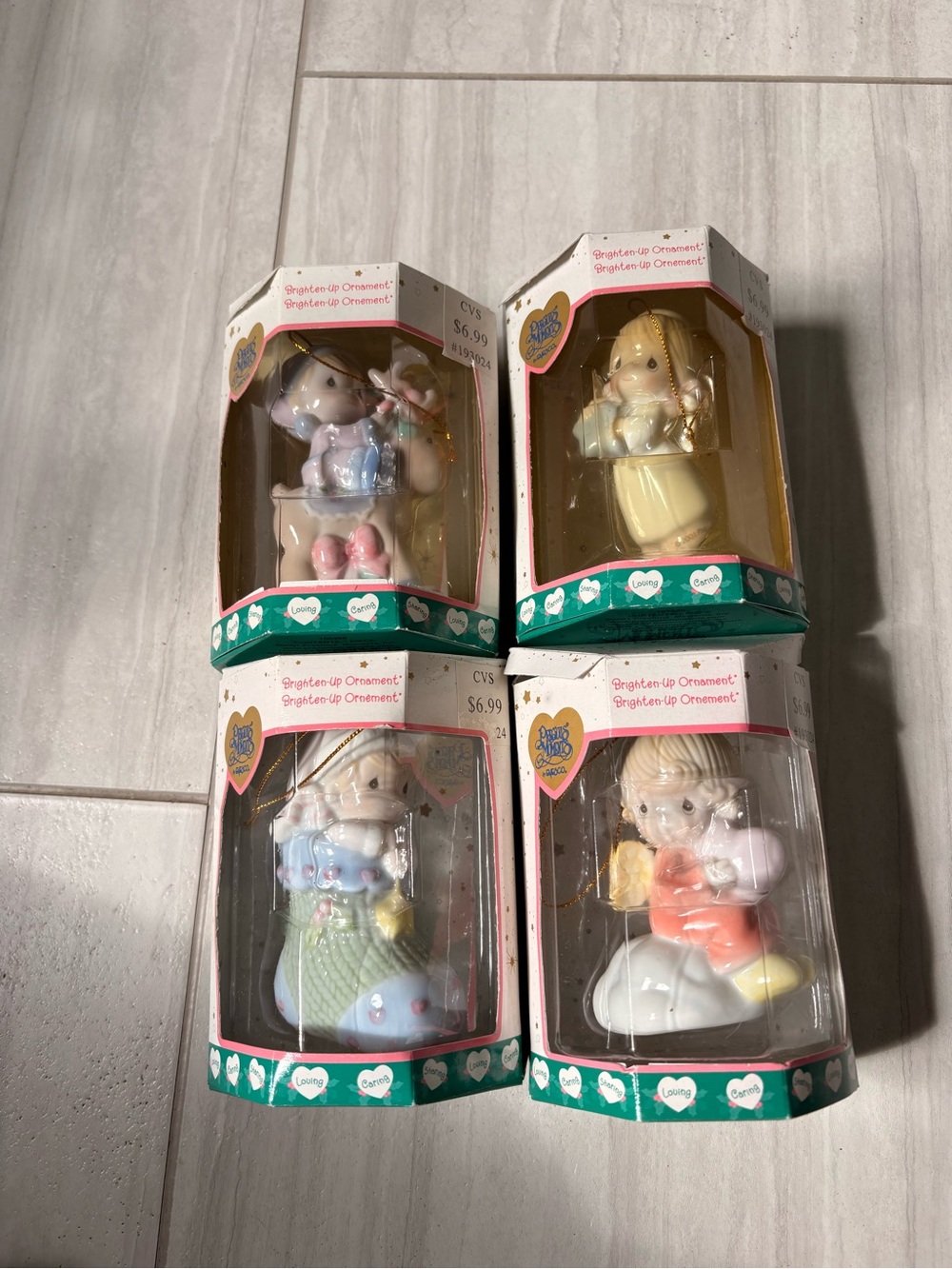 Lot of 4 NIB precious moments ornaments. All brightens up with tree light